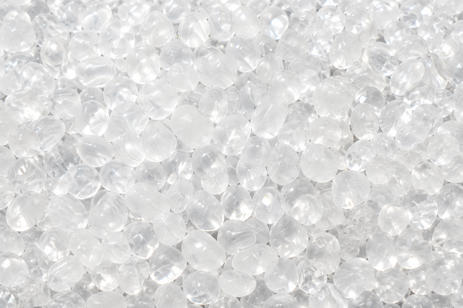 Close-up of the clear polyphosphate scale control media beads.
